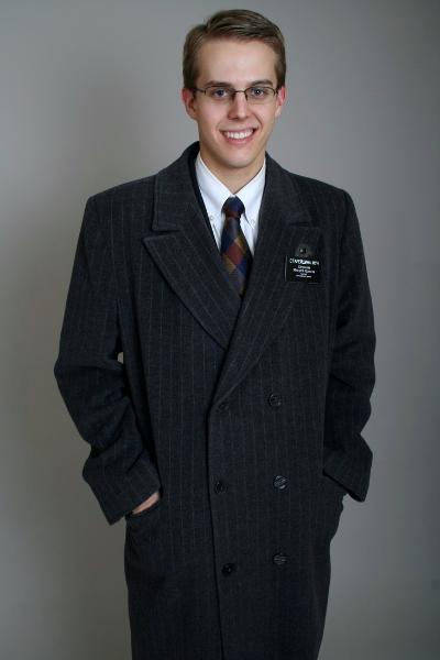 Elder Moon showing off his European Overcoat for his family.