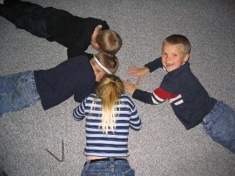 Jenn's kids.  We played a game where the kids had to stick the foreheads on the ground and hold them that way.  That was the end of the game, but they didn't know it, and I wanted to see how long they would stay that way before realizing the game was over...  What a mean uncle I am.