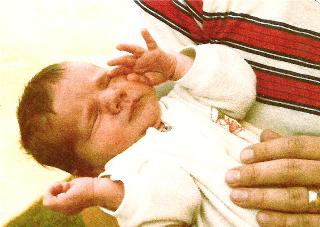 This is me when I was about Audrey's age.  It's a scan of a scan, but it really lets you know how much my baby looks like me...