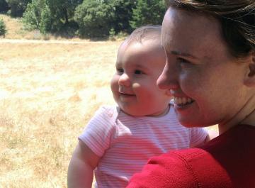 Laura and the baby at the meadow.