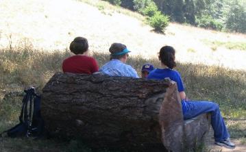 Laura, her Mom and her sister resting on the hike.  You can kind of see my father-in-law's head, too.