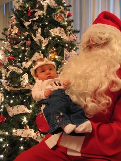 Our neighbor dressed up as Santa, and let us come over and take pictures.