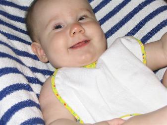 Audrey really excited for rice cereal.  I snapped this one during the prayer...  :)