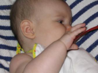 Audrey trying her first bite of rice cereal.