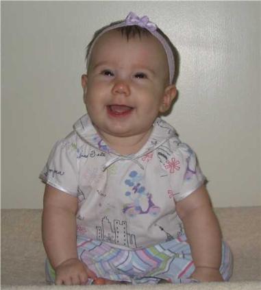 Audrey sitting up all by herself.  She's such a cutie.  She still falls quite a bit, but she's getting better and better at sitting every day!
