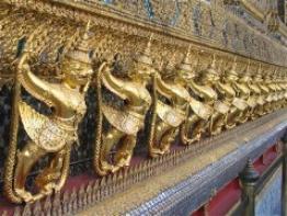A row of statues outside of the Emerald Buddha's temple.