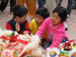 We went right after the Chinese New Year.  These kids were playing with a dragon costume in Stanley Market.