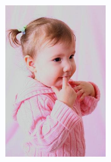 Although the left side is somewhat overexposed, I like it a lot.  Don't know if I like the finger in the mouth, but you can't do much about that.
