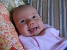 This is Audrey giving us a really big smile.  She's so beautiful when she smiles.  I love it.  Right now she tends to smile more at Laura, though.  I suppose it's because Laura feeds her.