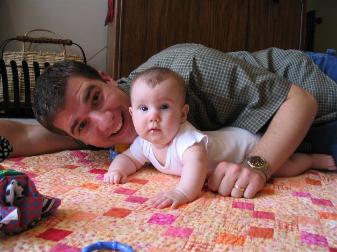 Daddy on the floor with Audrey.  Notice how good she's pushing up on her arms now.