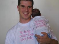 These are the shirts that my friend Weston got us as a baby shower gift.  We wore them for the first time today.  In case you can't read them, mine says 
